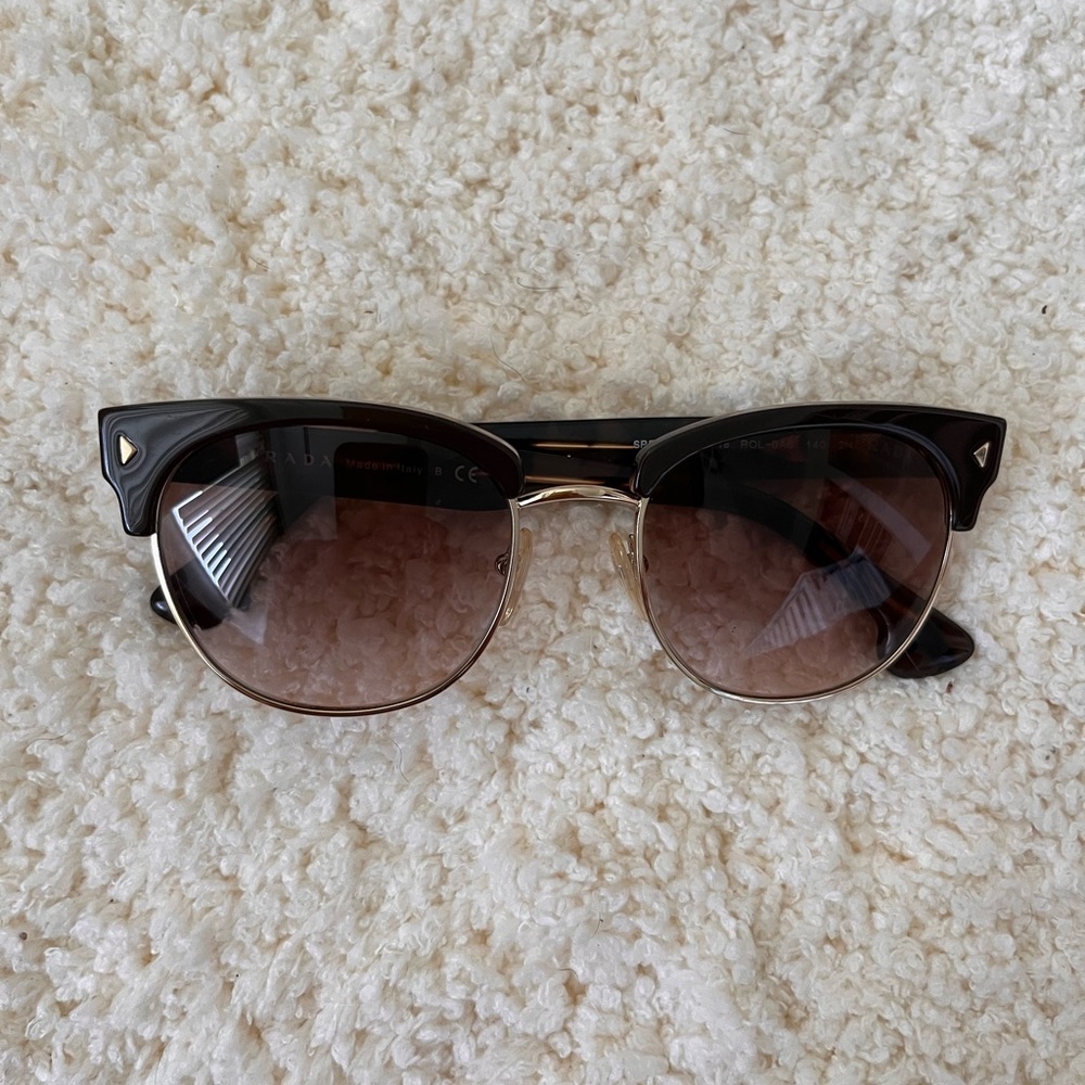 Prada sunglasses with brown gradient lenses. Like new!! Only wore it once